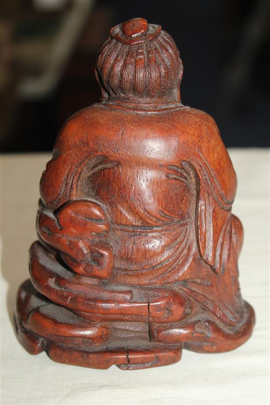 A Chinese bamboo seated figure of an immortal, 13.5cm